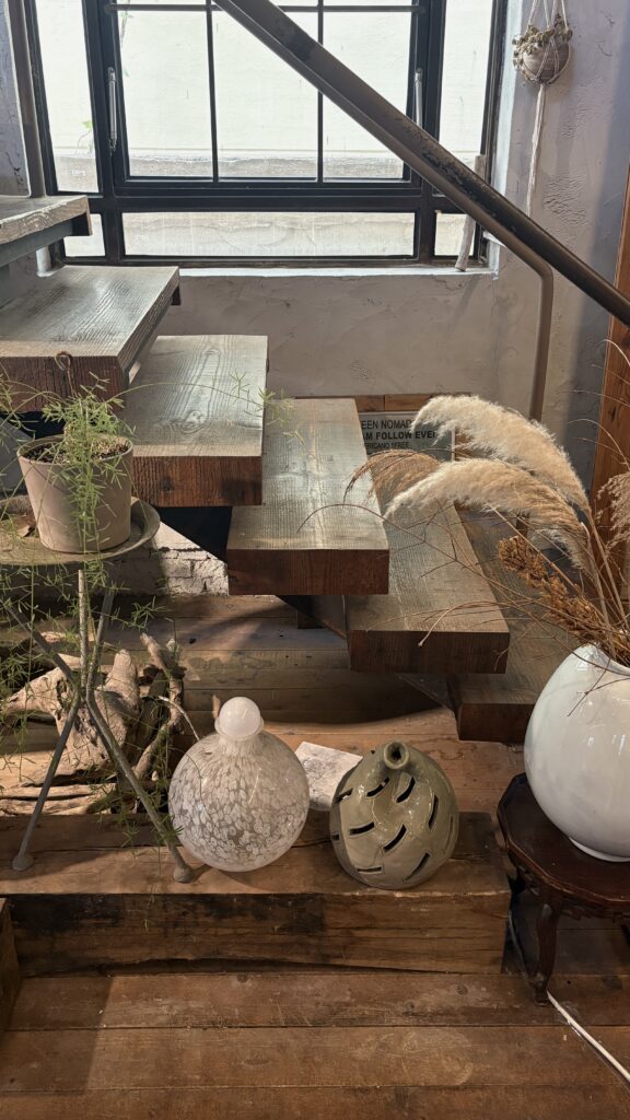 View looking up the wooden stairs toward the 2nd floor at Green Nomad Busan