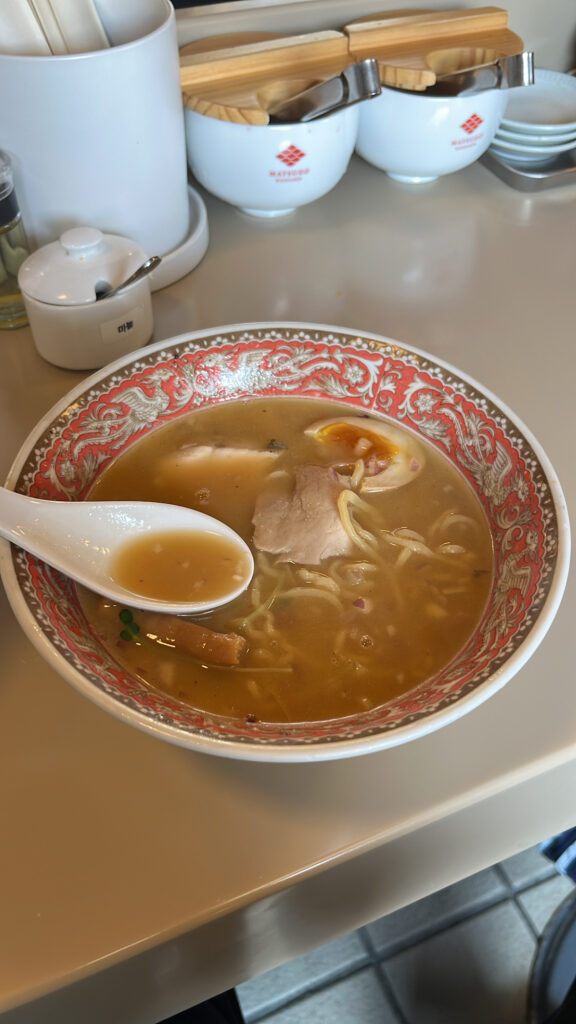 Pork and tender chicken breast chashu toppings in rich miso broth at Matsudo Busan