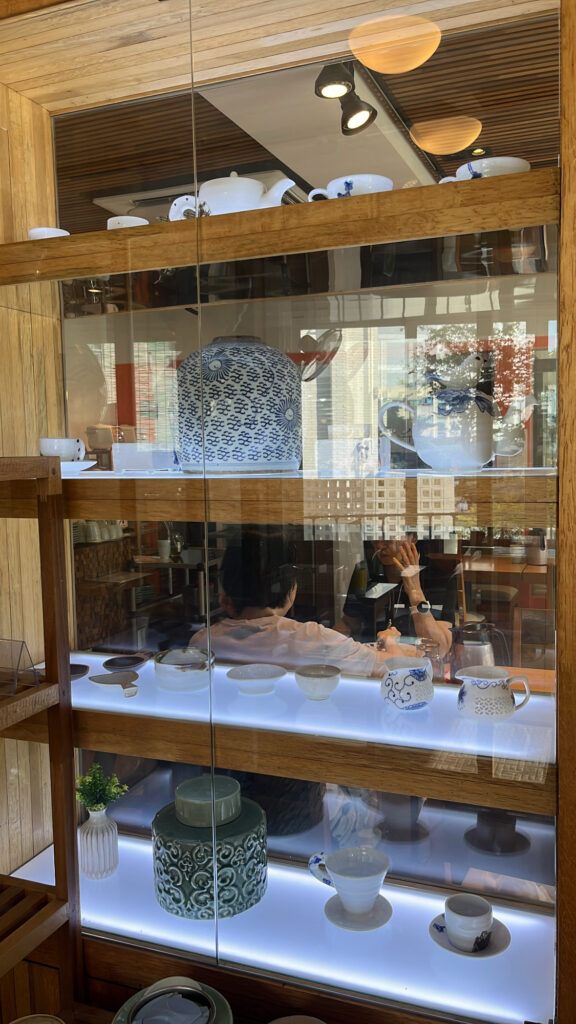Traditional Asian dishware display inside Songjeongjib Busan