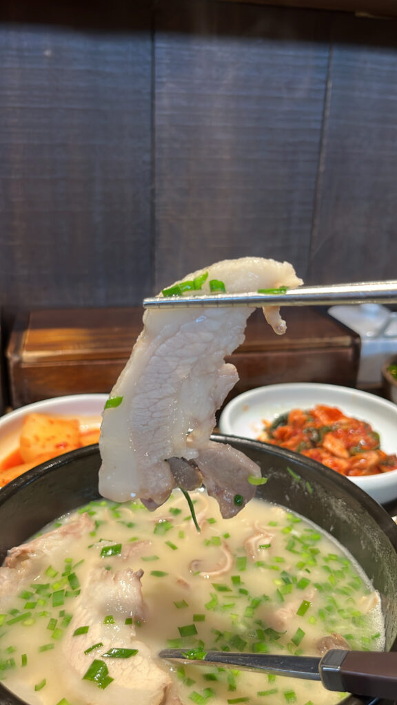 Tender pork slice served in EomYongBaek Doejigukbap Haeundae soup