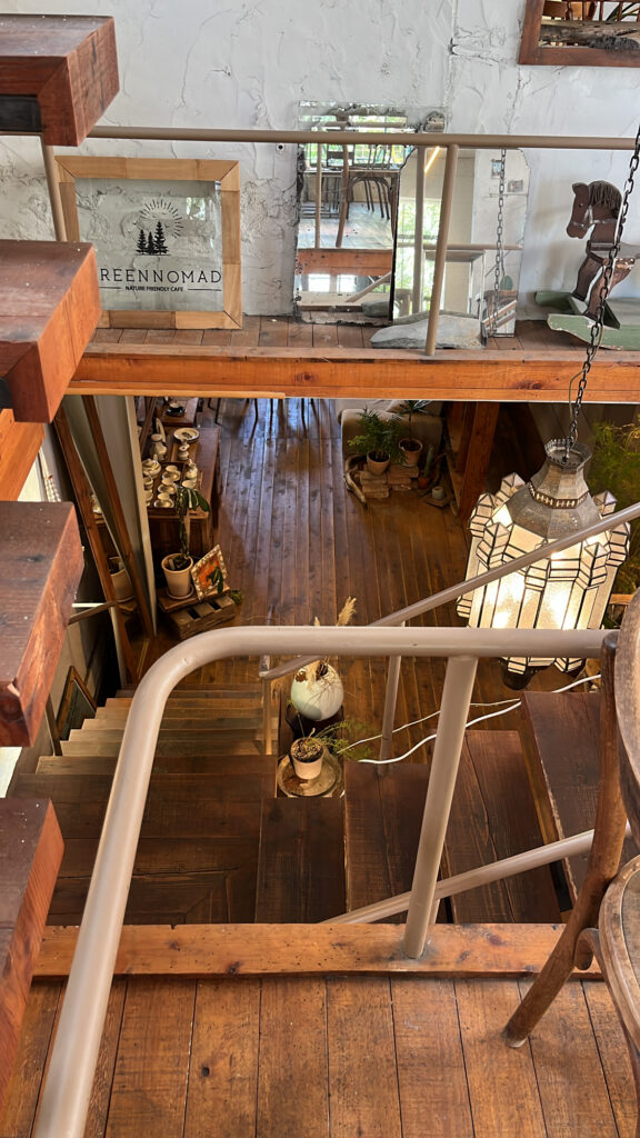 Wooden stair railing and 2nd floor entrance view at Green Nomad Busan