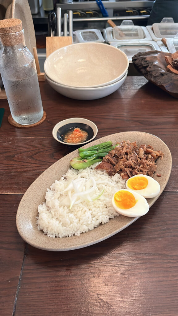 Savory Khao Kha Mu braised pork leg rice served with boiled egg at Pili Pili Busan