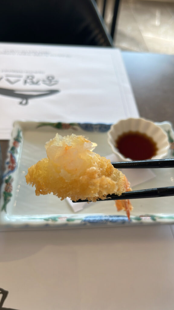 Close-up showing the plump, juicy, and tender shrimp inside the crispy tempura coating