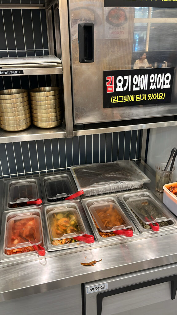 Self-service side dish bar at Wandduk Sundubu Centum City Korean food spot