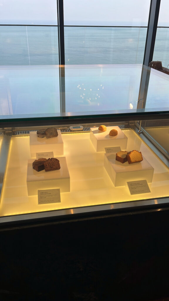 Bakery display counter overlooking the ocean at McQueen's Lounge Busan