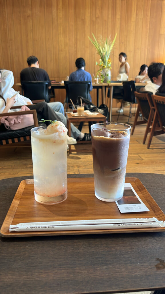 Signature Chocolat Nuage and Plum Sorbet Iced Tea served on a wooden tray at Momos Coffee Marine City