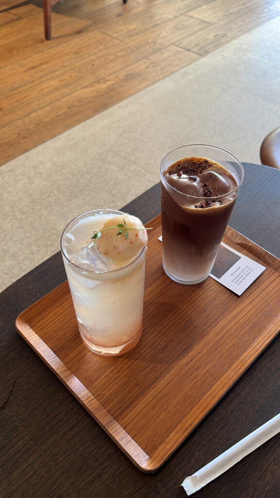 Close-up of refreshing Chocolat Nuage and iced plum sorbet tea at Momos Coffee Marine City