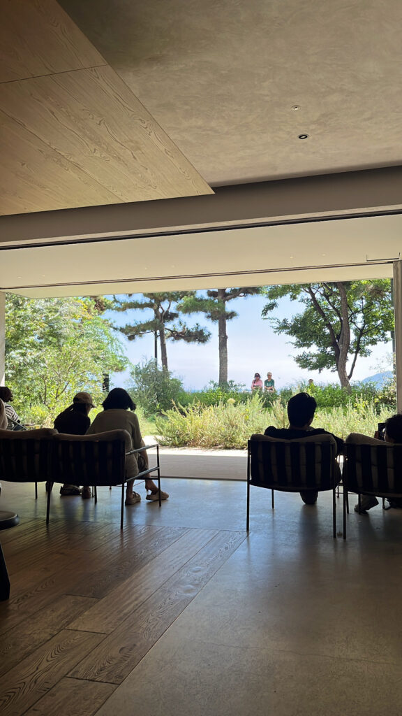 Popular waterfront window seating area overlooking the garden at Momos Coffee Marine City