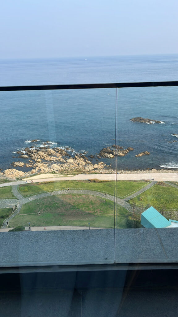 Scenic hotel garden and coastline view from the 10th floor of McQueen's Lounge Busan