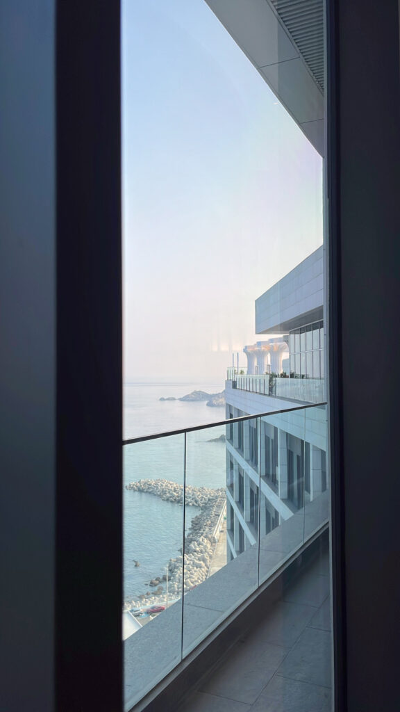View of the coastline and neighboring McQueen's Bar from McQueen's Lounge Busan