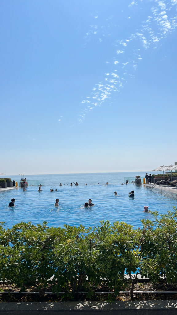 Picturesque coastal horizon and clear blue sea viewed from the swimming pool