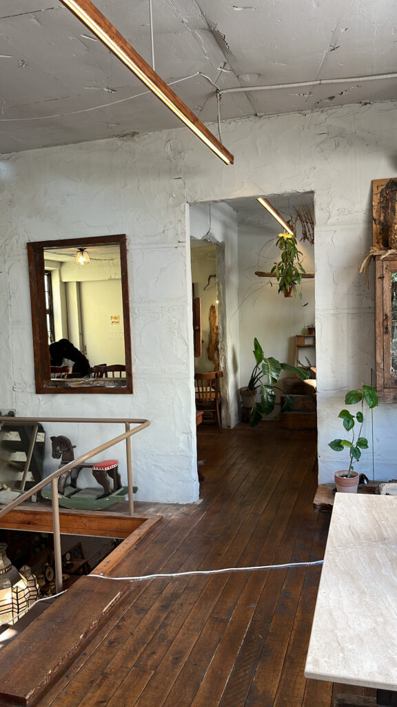 Spacious and unique 2nd-floor room decorated with vintage mirrors and furniture at Green Nomad Busan