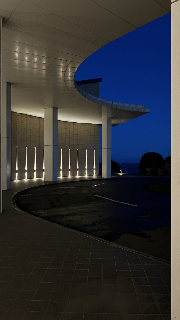 Beautiful dusk view of Ananti at Busan Cove with warm exterior lighting