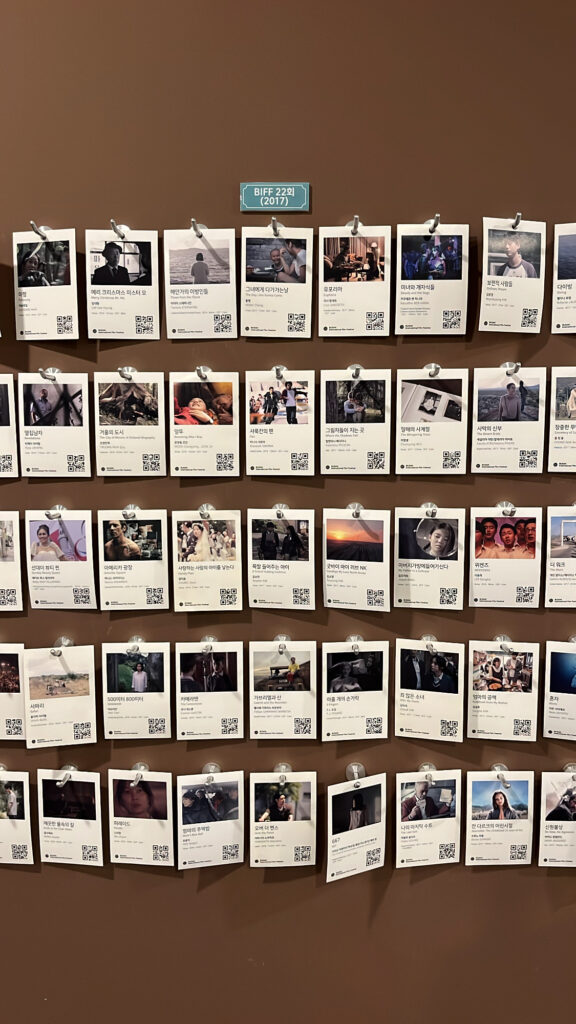 Close-up of numerous BIFF award-winning and invited film cards on the archive wall