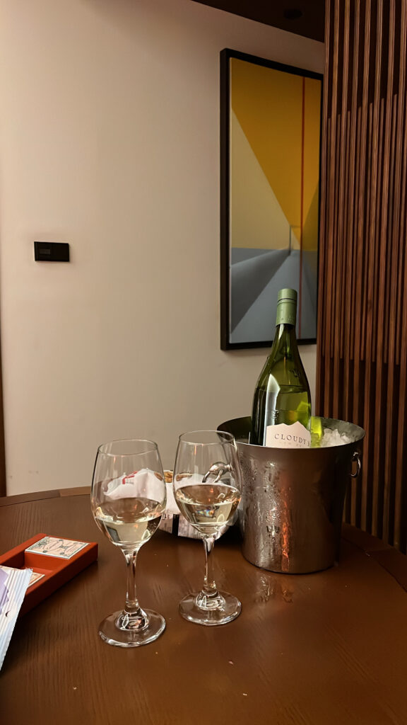 Affordable fine wine bought from the on-site market enjoyed in room