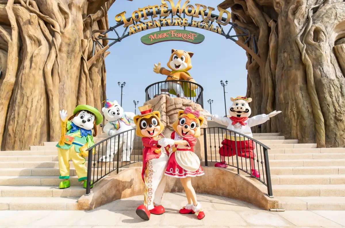 Lotte World Adventure Busan theme park entrance with mascot characters posing in Gijang
