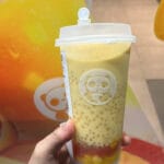 Refreshing Mango Pomelo Sago drink held in hand at ChaPanda Busan Centum