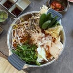 Jang Deuk Chun Shabu Kalguksu Busan full table setting with fresh ingredients