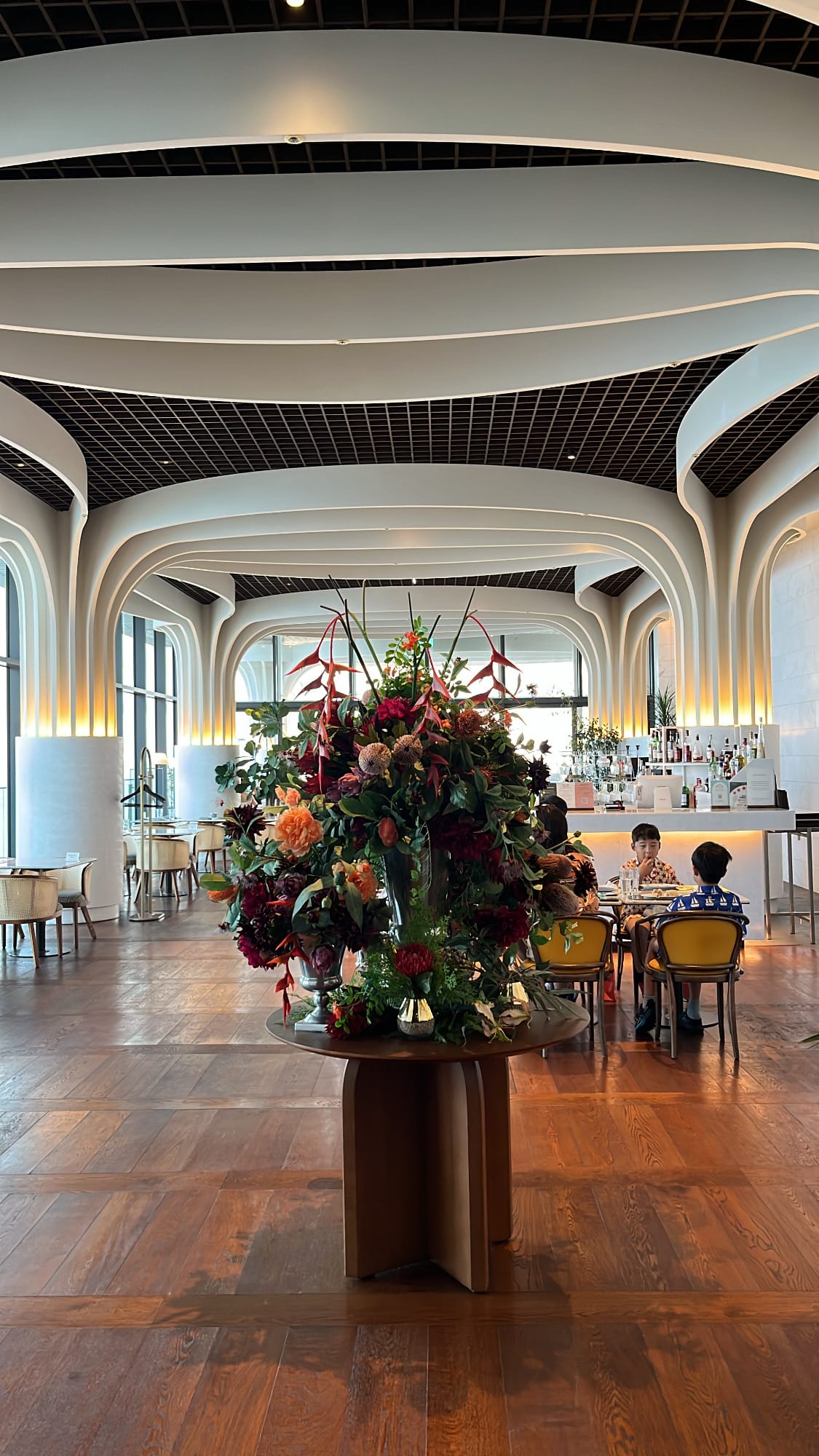 Luxurious main dining hall with floral decor at McQueen's Grill and Bar Busan