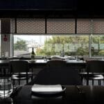 Clean modern table setting and window view at Michael's Urban Farm Table Busan