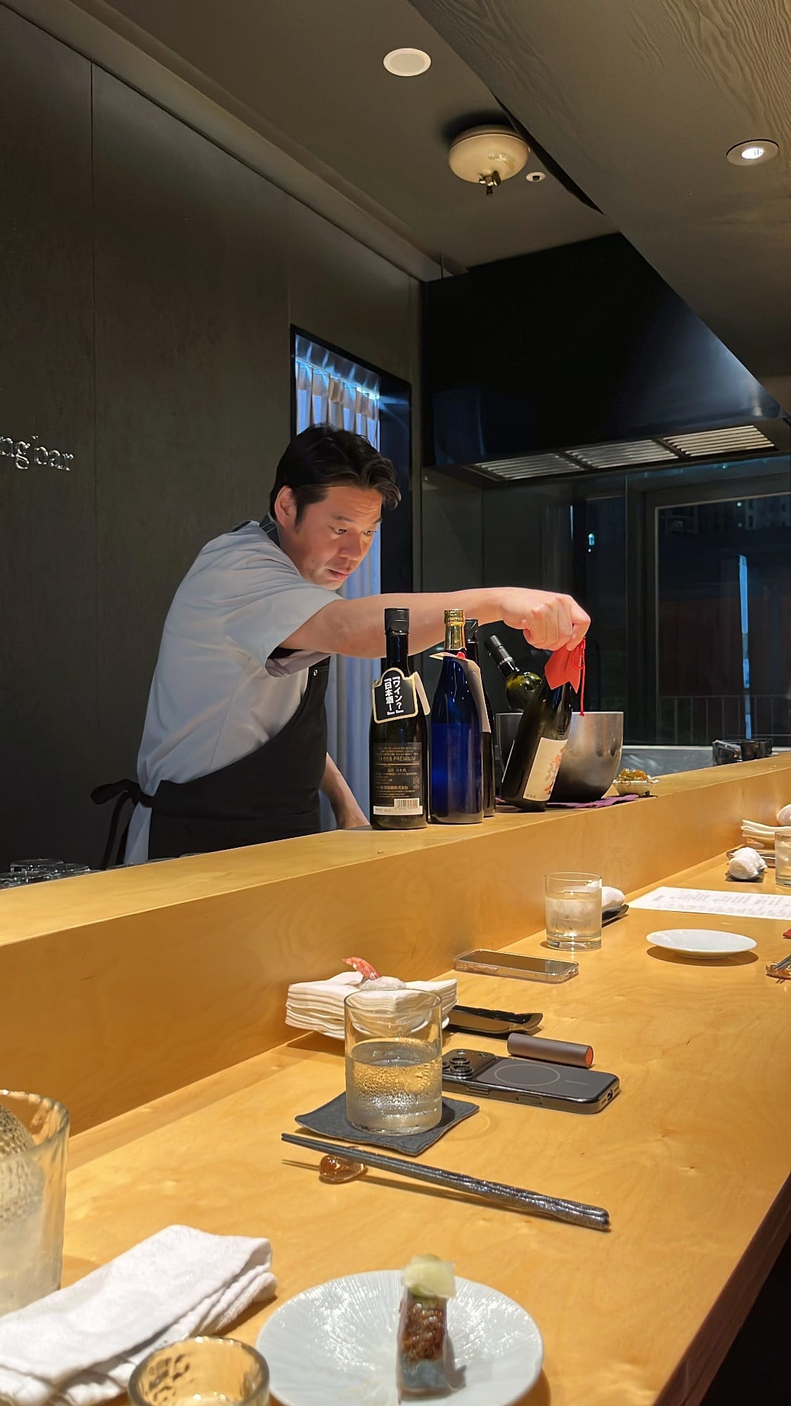 Japanese chef cooking behind the counter bar at Murasaki Busan