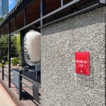 Traditional white Japanese lantern and Michelin Guide plaque at entrance of Unaju Busan