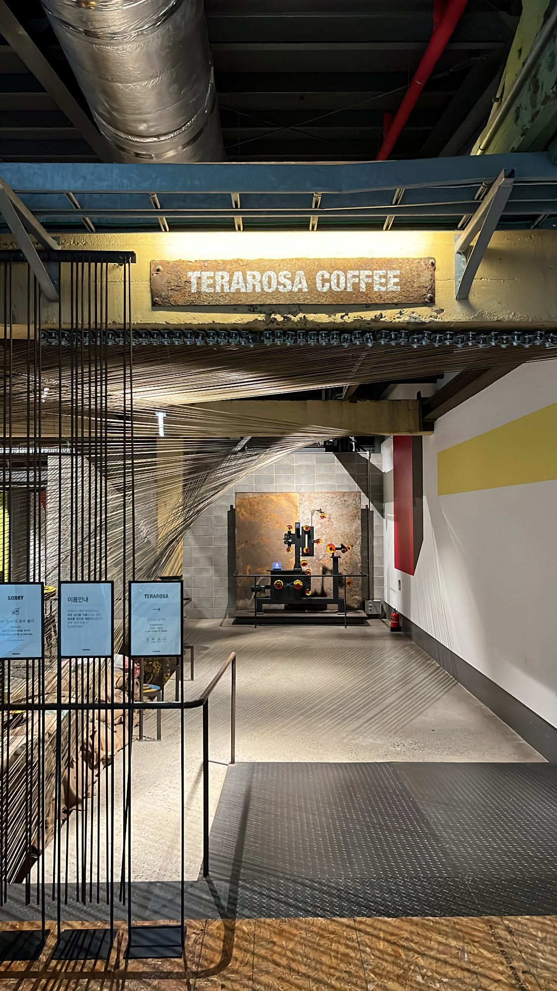 Vintage steel Terarosa Coffee sign inside renovated wire factory