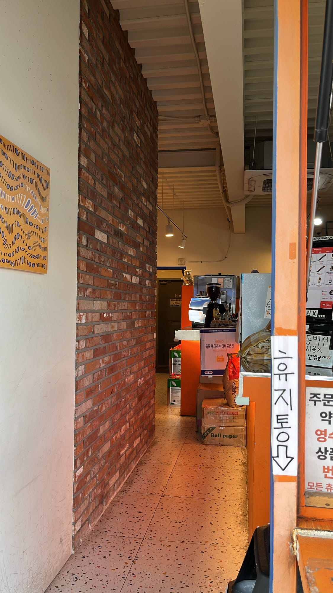 Narrow and cozy interior kitchen hallway inside Chuplus Songjeong Busan