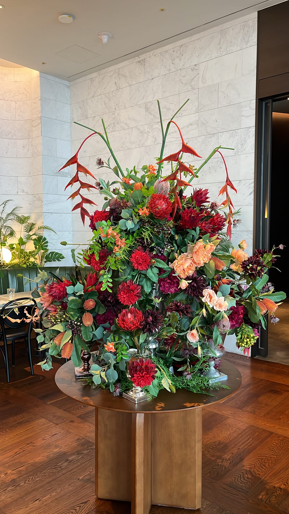Grand floral centerpiece in the upscale dining space at McQueen's Grill and Bar