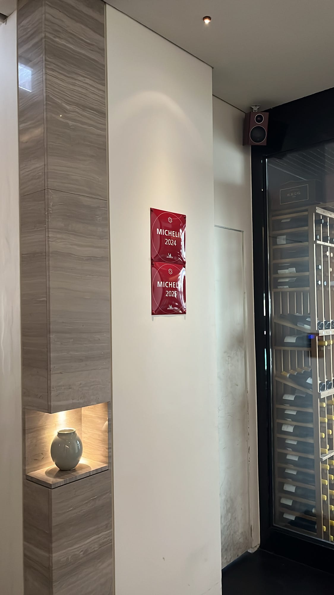 Michelin Guide plaques and wine cellar at Palate Busan