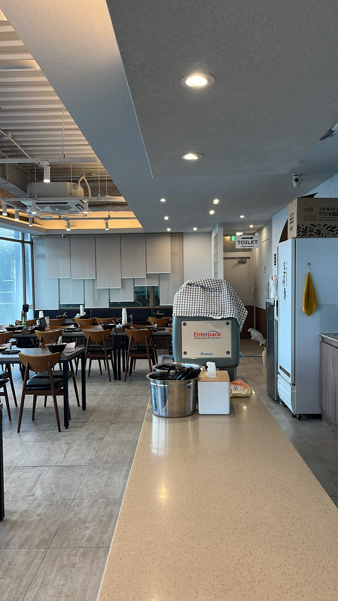 Spacious and bright dining hall interior at Jang Deuk Chun Shabu Kalguksu
