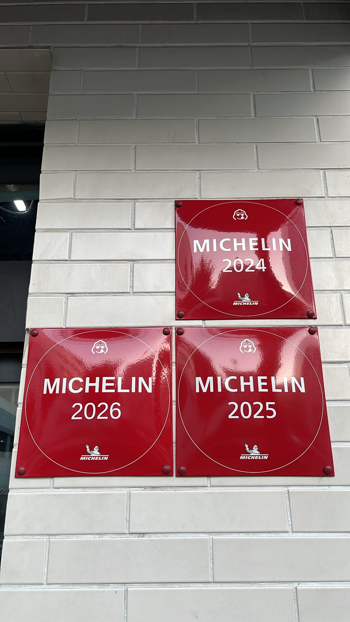 Three consecutive Michelin Guide Busan red plaques for 2024, 2025, and 2026 at Anmok Busan