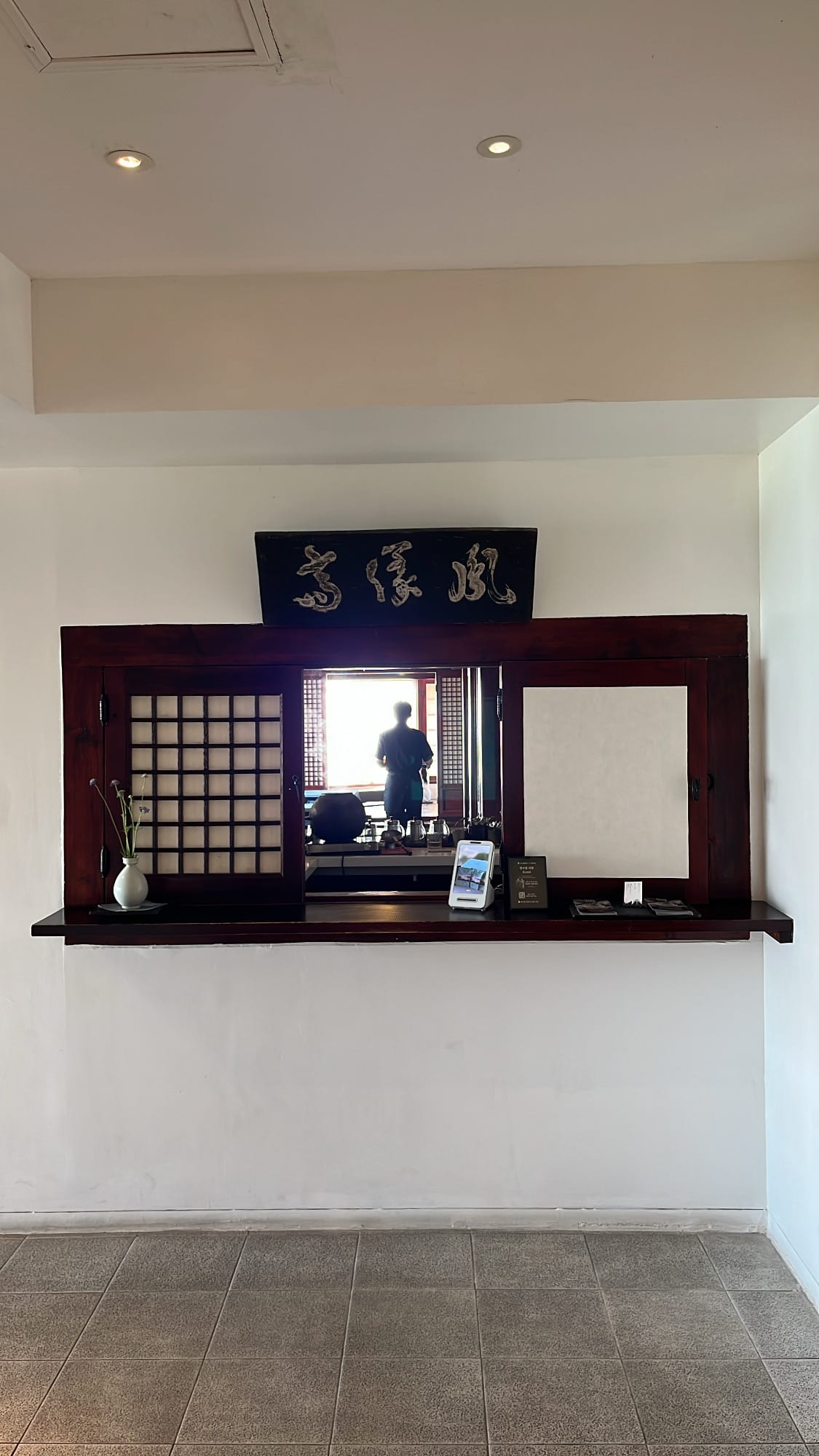 Traditional wooden reception counter inside Bibibidang Busan