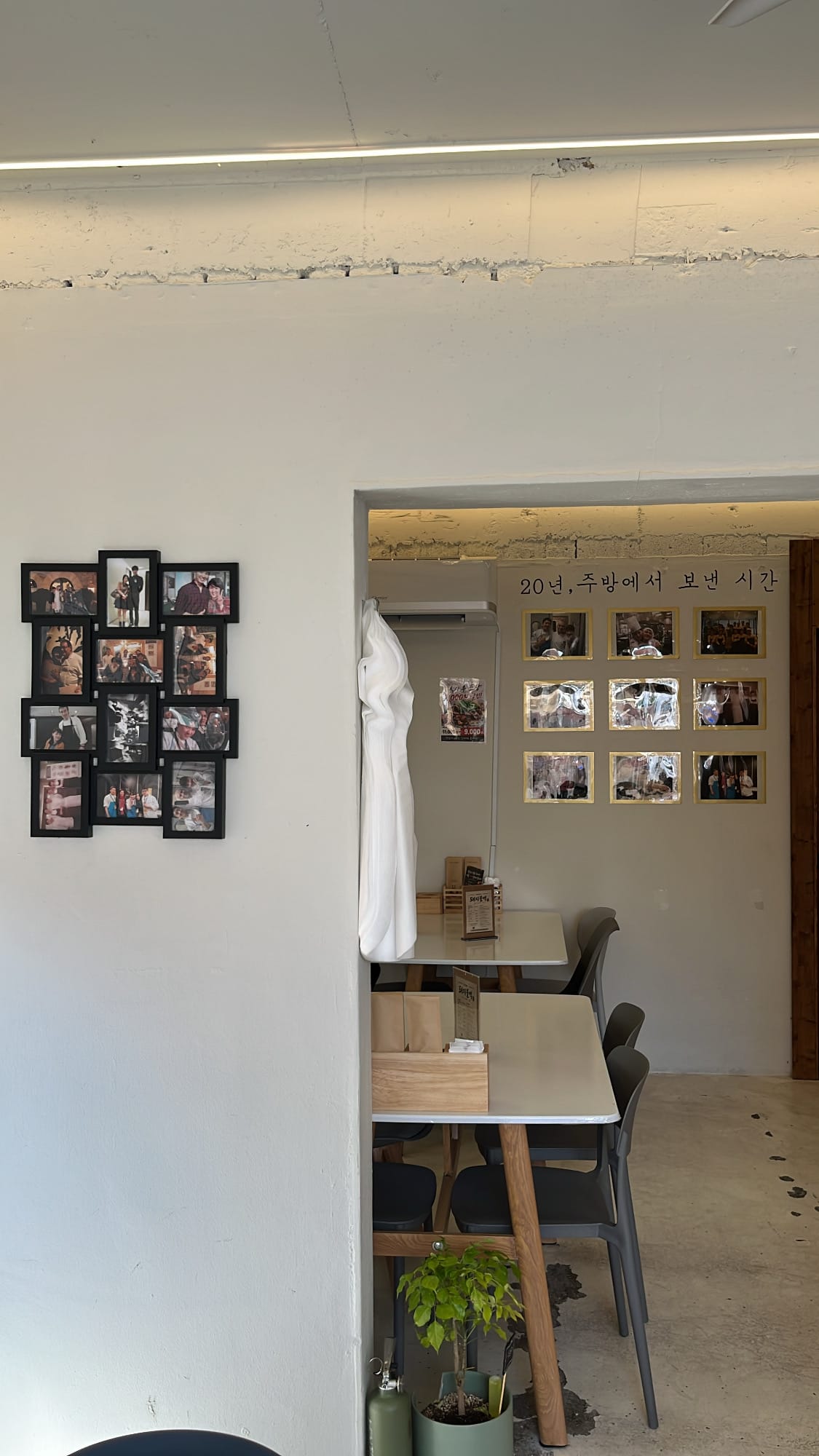 Warm dining room interior with wooden tables at Chef202 Busan