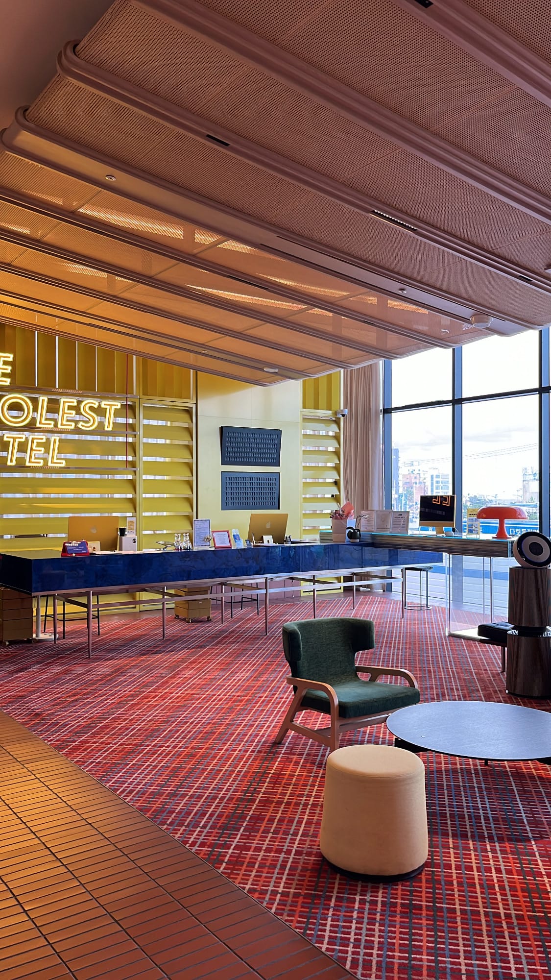 Spacious lobby lounge with curved ceiling at The Coolest Hotel