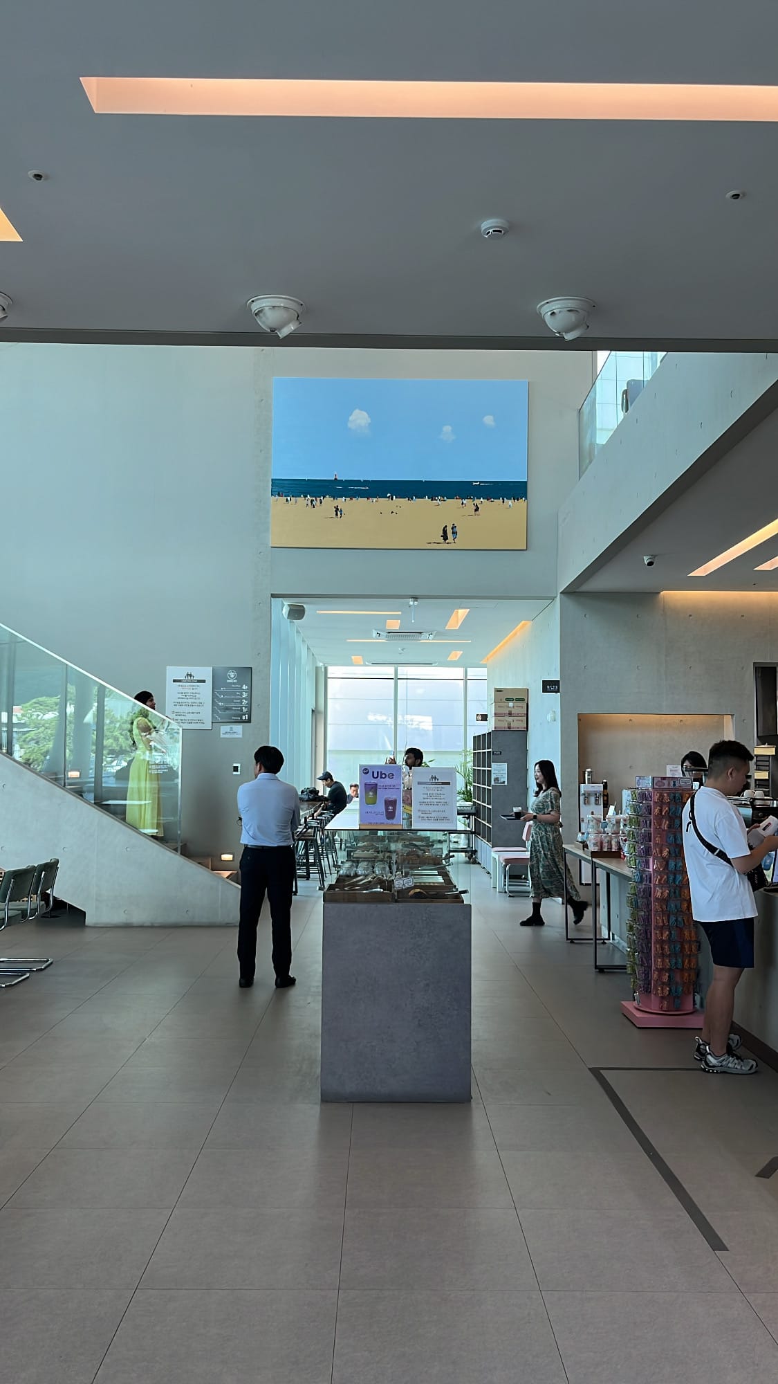 High ceiling entrance hall and order counter inside Coralani Busan