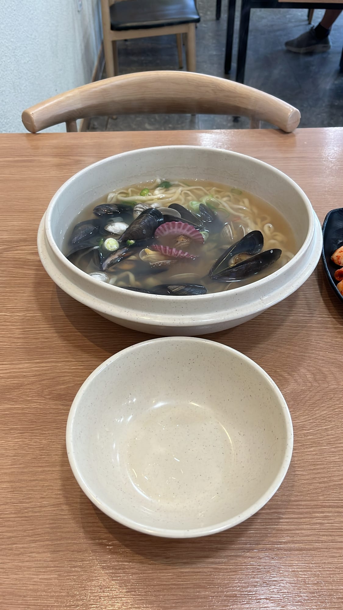 Massive stainless steel bowl of seafood kalguksu served at Haeundae 31cm Seafood Kalguksu