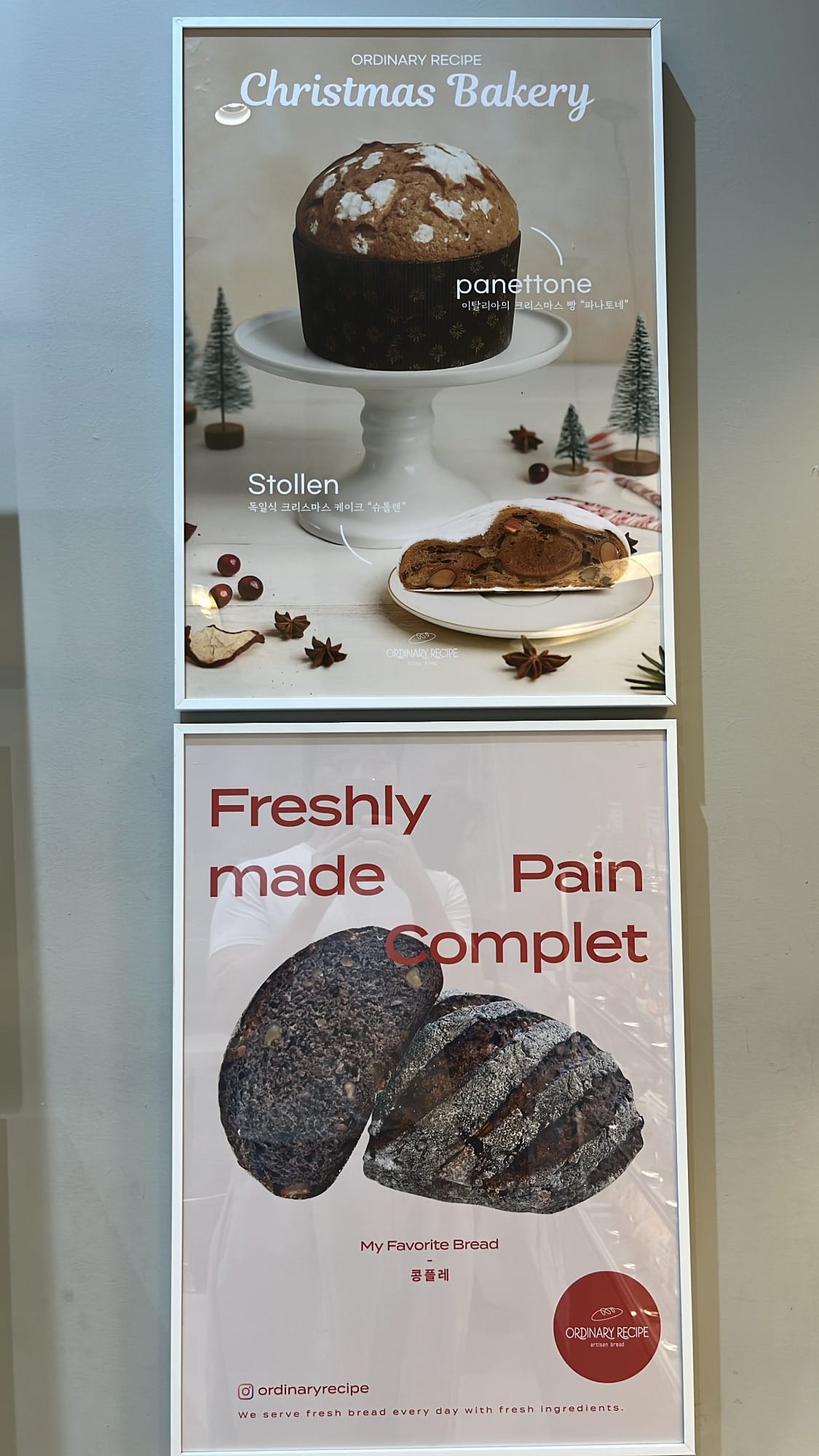 Framed posters showcasing seasonal Panettone, Stollen, and Pain Complet at Ordinary Recipe Centum