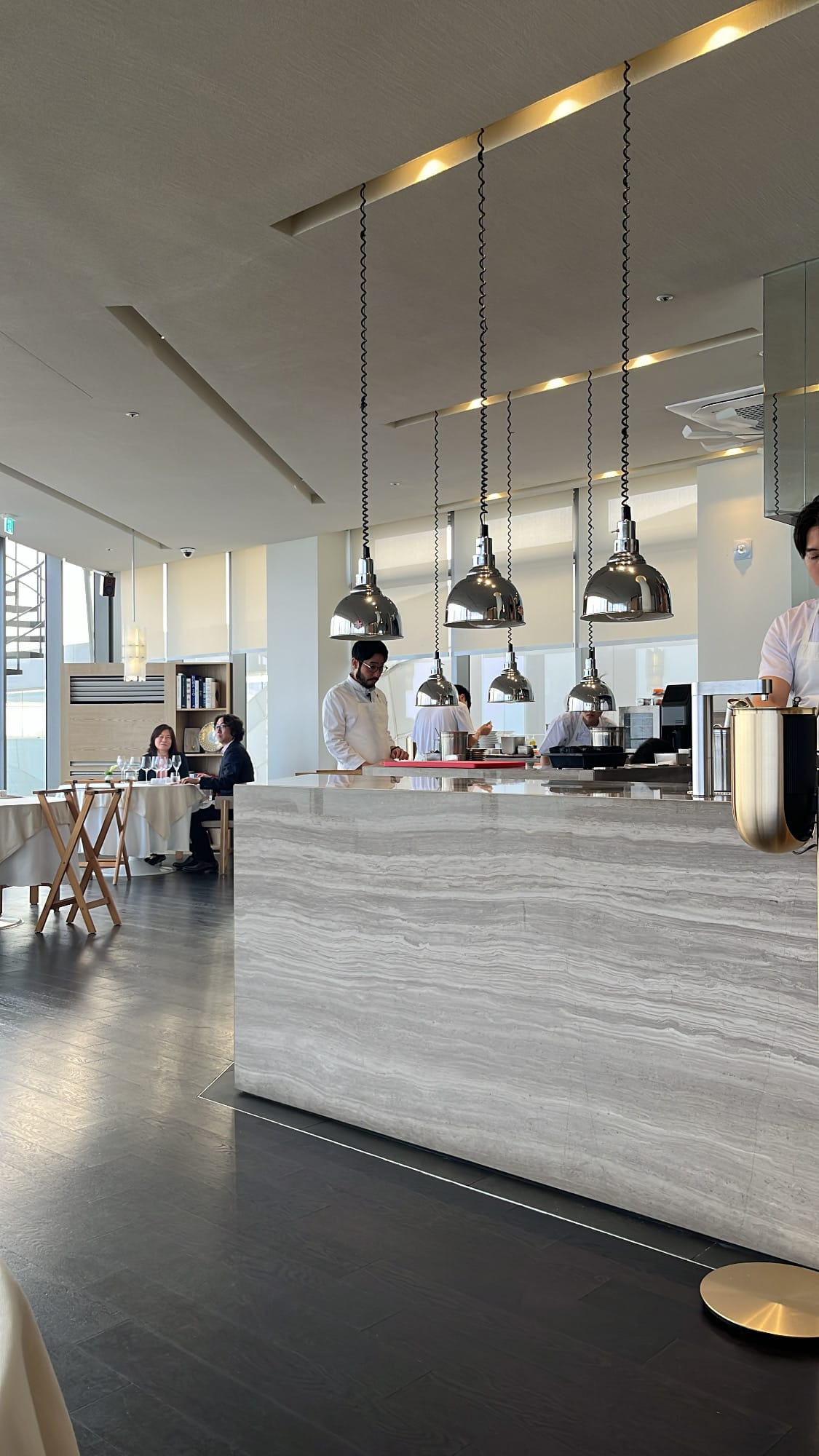 Bright open kitchen and modern interior at Palate Busan