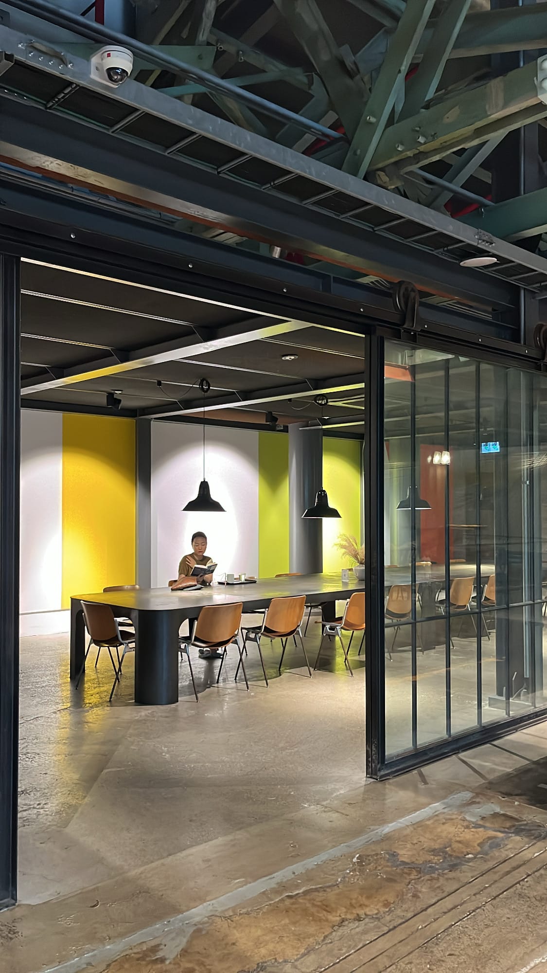 Private glass conference room with long table at Terarosa Coffee