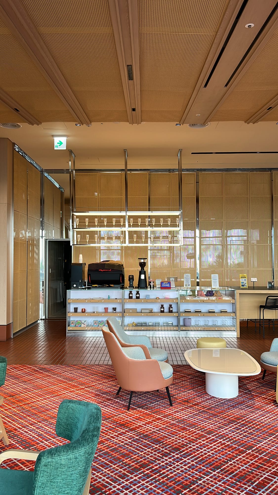 Modern cafe bar and display shelves in The Coolest Hotel lobby