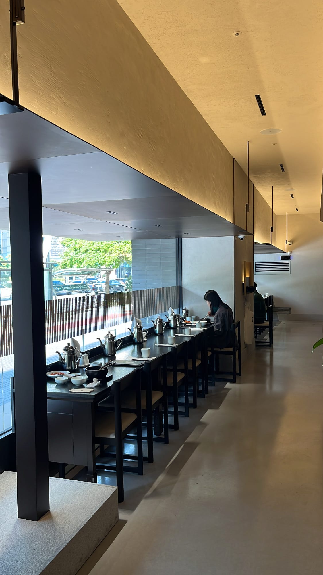 Solo dining counter bar overlooking the street at Geodae Gomtang Busan