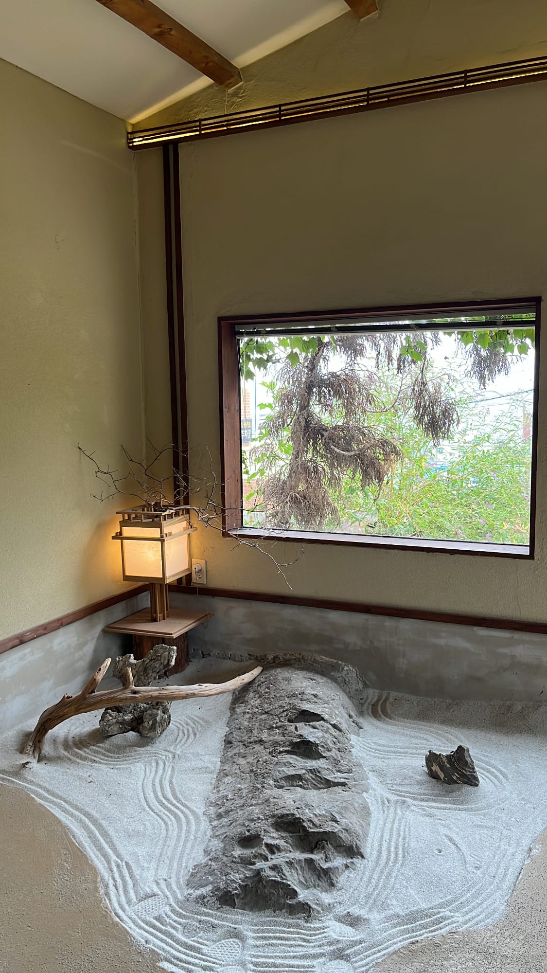 Indoor Zen rock garden with raked white sand at Simmian Busan