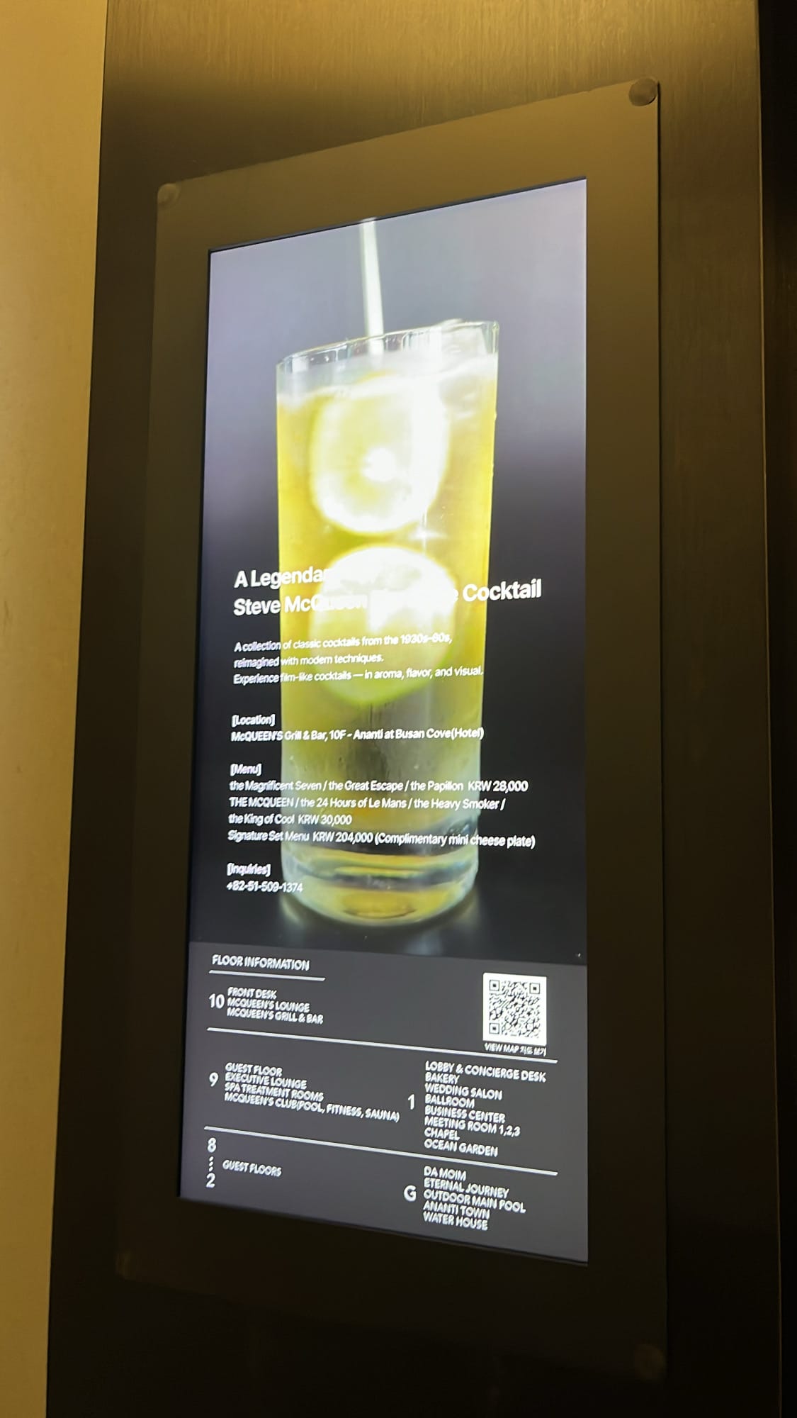 Digital floor directory and Steve McQueen cocktail menu at McQUEEN'S Grill & Bar