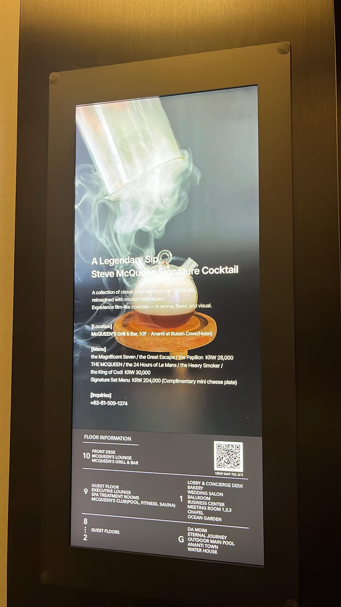 Smoked signature cocktail presentation on screen at McQUEEN'S Grill & Bar Ananti at Busan Cove