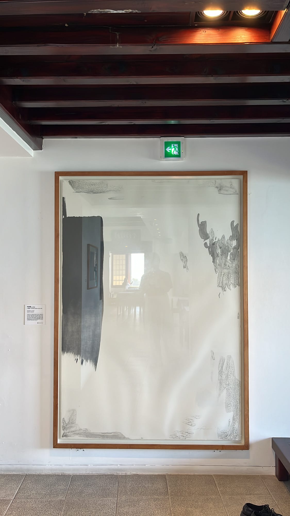 Minimalist abstract art painting hanging on the gallery wall