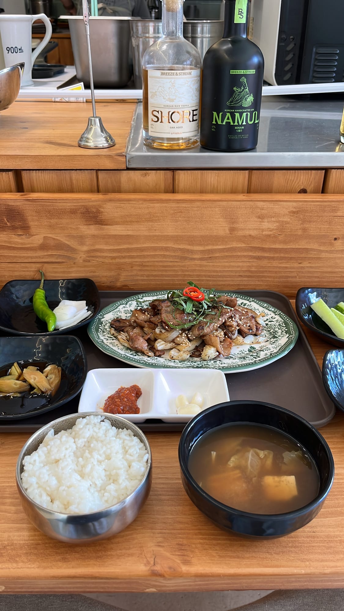 Full table spread of pork bulbaek set meal with soup and rice at Chef202 Busan