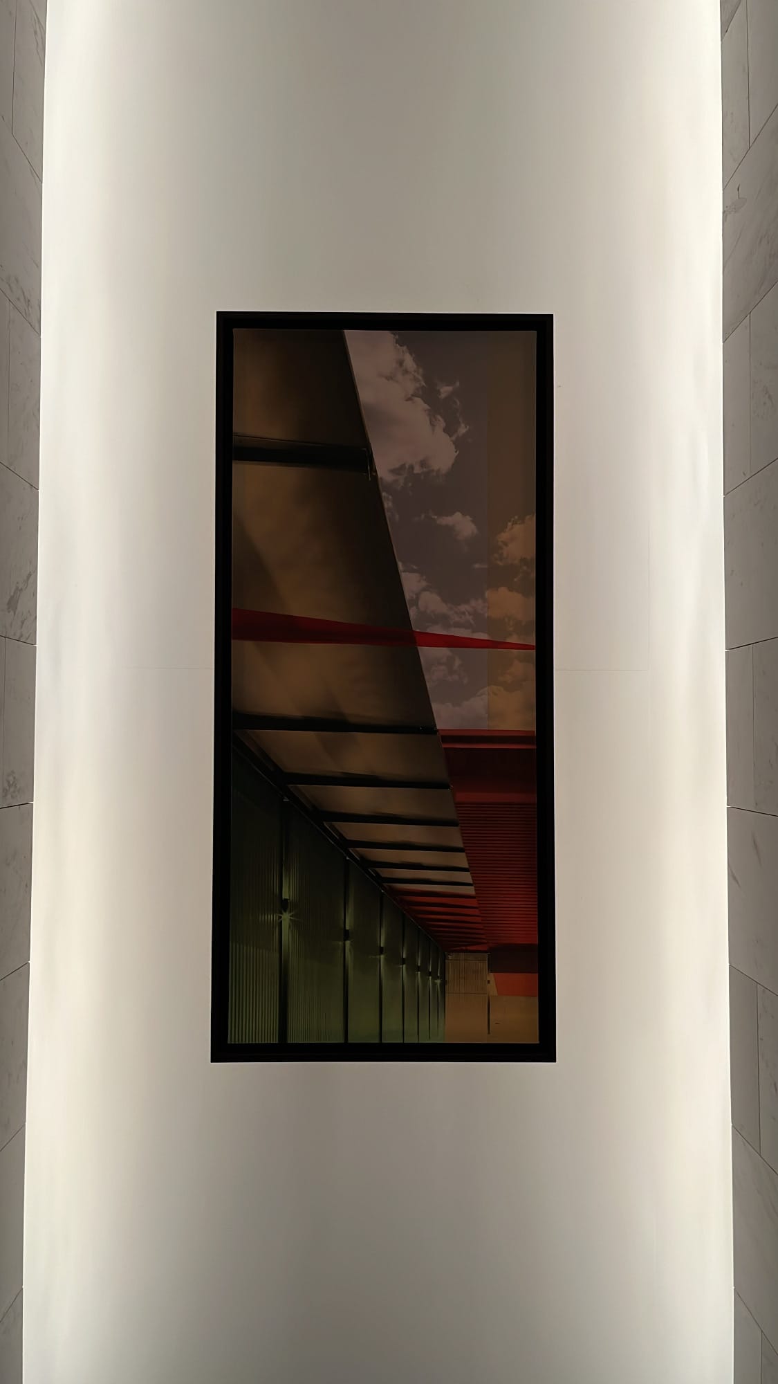 Moody architectural lighting and modern wall design inside McQueen's Grill and Bar
