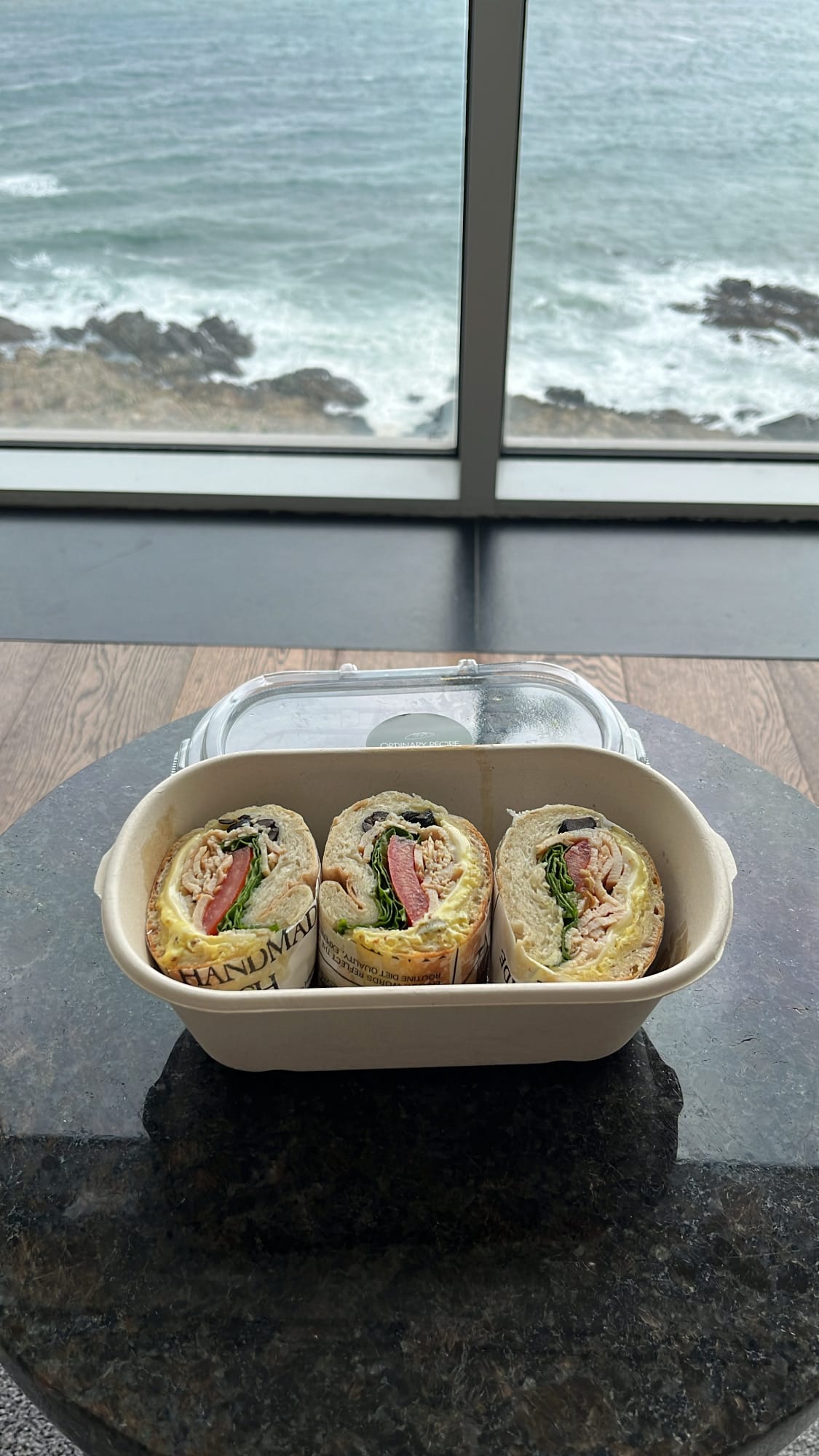 Ordinary Recipe Centum takeout chicken sandwich enjoyed beside a scenic Busan ocean view