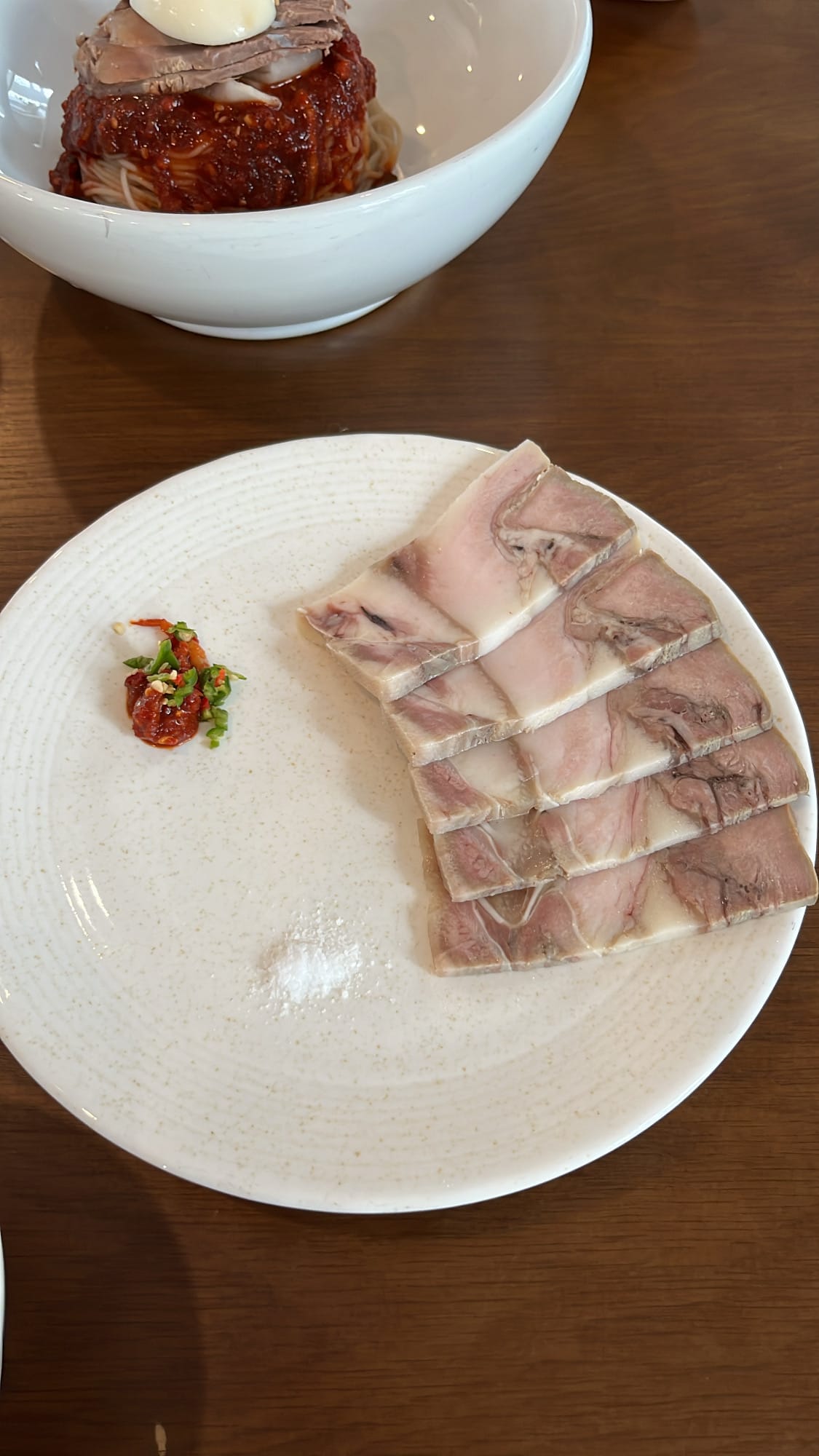 Half portion of chewy sliced boiled pork served at Yangkyungoak Busan